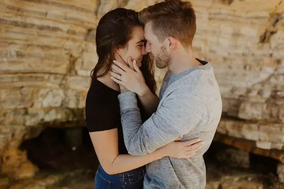 Couple embracing each other after the proposal and the moment being captured by photographer Dani Purington