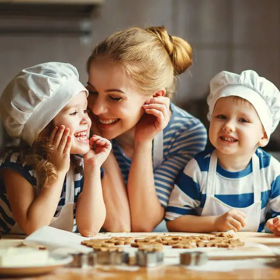 A mother lets her two toddlers help her cook to avoid unwanted tantrums in the house