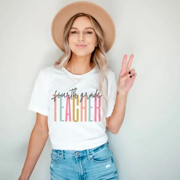 A lady wears a customized t-shirt with printed text Fourth Grade Teacher