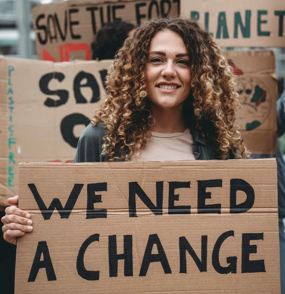 Gen Zer protesting for clean energy to remedy the climate crisis